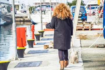 Woman At The Seaside Walking The Dog