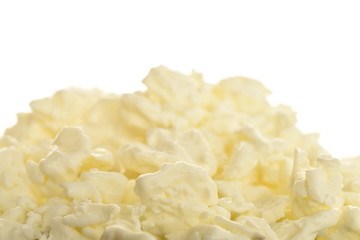 Fresh tasty, nutritious cottage cheese, close-up, on a white background.