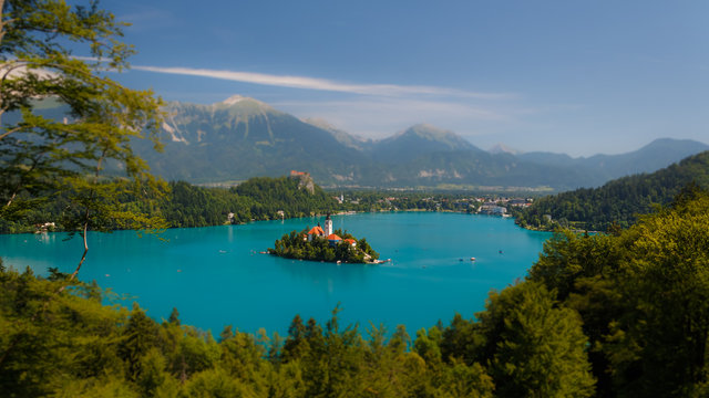 View of the island with a temple on Lake Bled. Tilt Shift Effect. Miniature effect. - Powered by Adobe