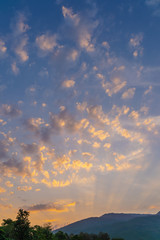 Dramatic sunset sky with orange clouds, beautiful sunset with blue sky and clouds