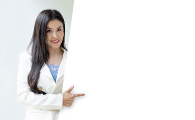 Naklejka premium Portrait Call Center Operator woman wearing a telephone headset showing blank signboard with copy space area isolated on grey background.