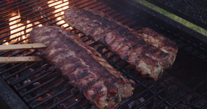 Pork ribs cooking on barbecue grill