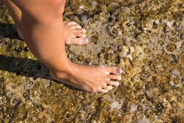 Girl's foot on a rock, Adriatic Sea, Croatia