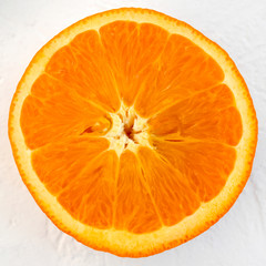 Close up fresh orange on white background. Health food, detox, dieting and anti-cellutite cosmetic concept.