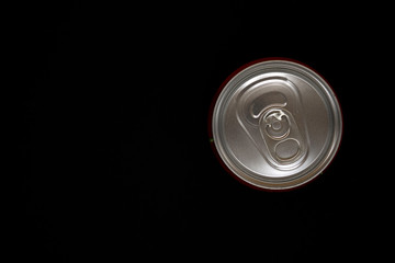 Can of soda from overhead view on a black background