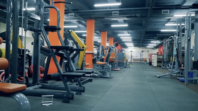 Small business concept. Many training machines in an empty gym.