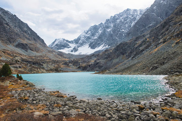 The landscape of mountain lake with unusual color of water