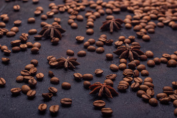 Scattered grain coffe on a dark concrete background