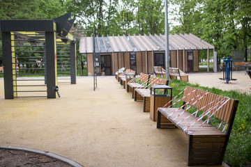 Park benches wrapped in connection with the coronavirus pandemic. social distance, forbidden to sit down, covid-19