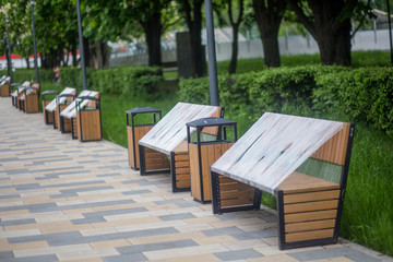 Park benches wrapped in connection with the coronavirus pandemic. social distance, forbidden to sit down, covid-19