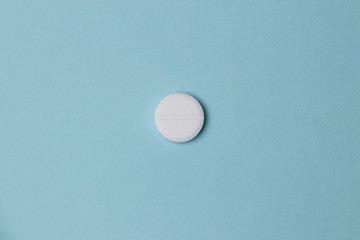  pills on  blue colored background. Medication and prescription pills web banner with copy space.
