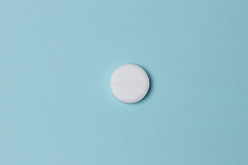  pills on  blue colored background. Medication and prescription pills web banner with copy space.
