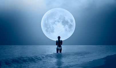 Night sky with moon in the clouds on the foreground power sea wave - Happy slim girl in white...