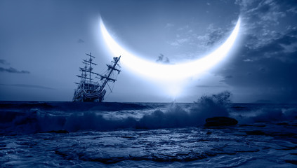Sailing old ship in storm sea - Night sky with crescent in the clouds 