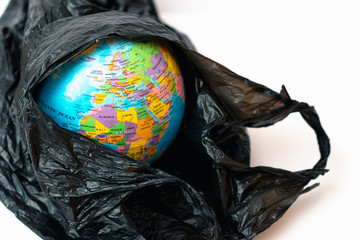 World Globe inside plastic bag you can see in hole different parts of the world.Ozone depletion in atmosphere concept.