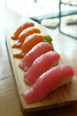 Close up Tuna and Salmon sushi on wooden plate
