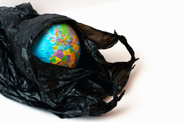 World Globe inside plastic bag you can see in hole different parts of the world.Ozone depletion in atmosphere concept.