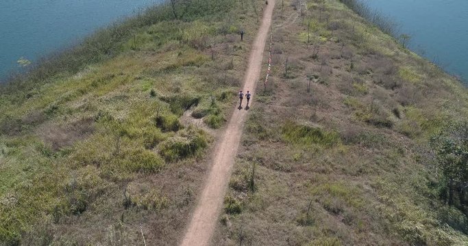 February 2019, aerial view of athletes running on mountain trail path in Dalat
