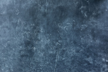 Abstract dark textured surface. Beautiful rich background in graphite colors and shades.