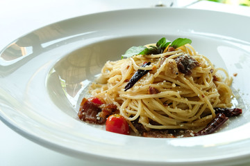 close-up chilli and basil spaghetti,fusion food ,Italian Thai style.background