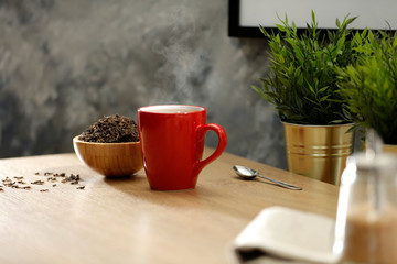 Hot tea on the table while relaxing with free space for an advertising product