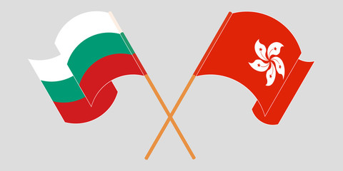 Crossed and waving flags of Hong Kong and Bulgaria