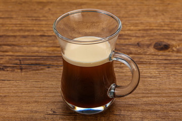 Hot Espresso coffee over wooden table