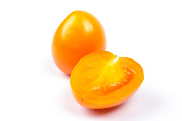 Yellow fresh tomatoes  isolated on white background in close-up