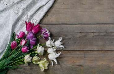 Bouquet of tulips on wooden table background. Celebration concept