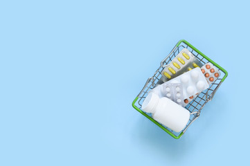 Set basket pills on a blue background. Healthcare. Flatly.