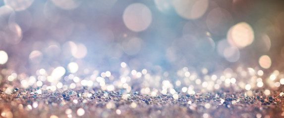 Obraz premium Christmas light background. Holiday glowing backdrop. Defocused Background With Blinking Stars. Blurred Bokeh.