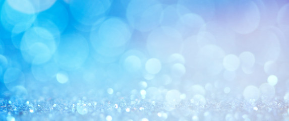 Obraz premium Christmas light background. Holiday glowing backdrop. Defocused Background With Blinking Stars. Blurred Bokeh.