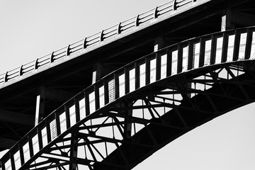 Closeup of metal suspension bridge.