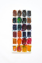 Paint palette, watercolor top view. Background, texture. A variety of colors.
