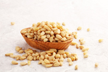 Some fresh Pine Nuts on vintage background. unshelled healthy vegetarian food background
