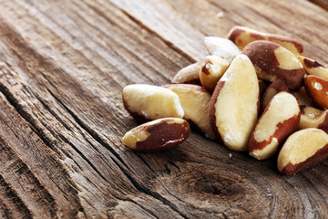 Brazil nuts on vintage background. unshelled Bertholletia healthy vegetarian food