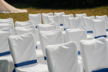 Beautifully decorated and arranged chairs for a festive Banquet. Decor, wedding