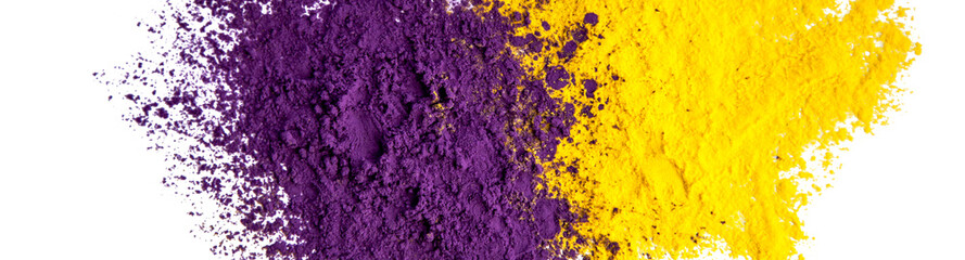 Abstract background of purple and yellow dry powder paints. Copy space in a center.
