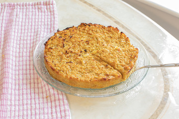 Homemade Roasted vegetable quiche pie with a wedge cut out. Delicious vegetarian food.
Onions carrots squash courgettes KUGEL 
