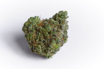 close up macro photo of high quality greenhouse grown medical and and recreational marijuana indica strain marijuana bud isolated on white background