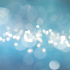 Fototapeta premium Christmas light background. Holiday glowing backdrop. Defocused Background With Blinking Stars. Blurred Bokeh.
