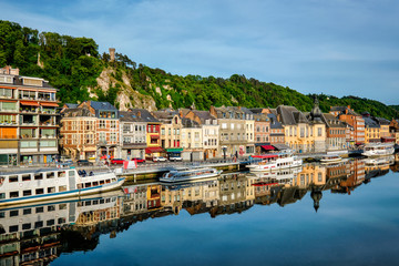 View of picturesque Dinant city over the Meuse river Dinant is a Walloon city and municipality located on the River Meuse, in the Belgian province of Namur. - obrazy, fototapety, plakaty