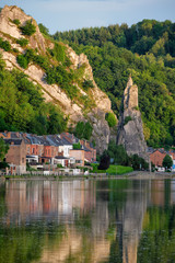 Fototapeta na wymiar View of picturesque Dinant city over the Meuse river Dinant is a Walloon city and municipality located on the River Meuse, in the Belgian province of Namur on sunset with Bayard Rock and highway