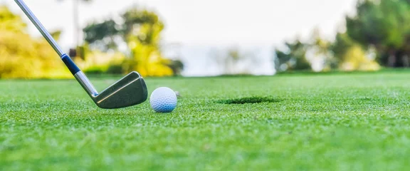 Foto op Plexiglas Golf clubs drivers over green field background © Vladimir