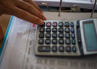 hand with calculator