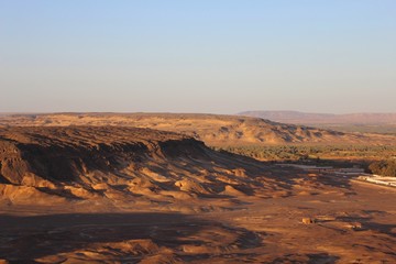 Arial view showing sunset at the top of the mountain at Bahariya oasis
