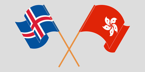Crossed and waving flags of Hong Kong and Iceland