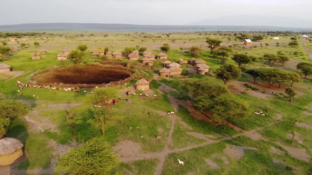 Aerial Drone Shot. Traditional Masai village at Sunset time near Arusha, Tanzania.