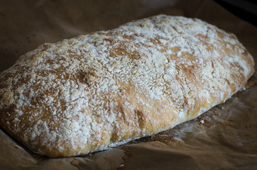 Italian ciabatta bread sliced on a board