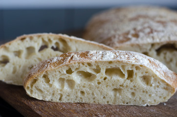 Italian ciabatta bread sliced on a board